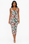 Tropical Curve midi dress by TrendzByShe featuring vibrant tropical print, sleeveless design, and knee-length hem.