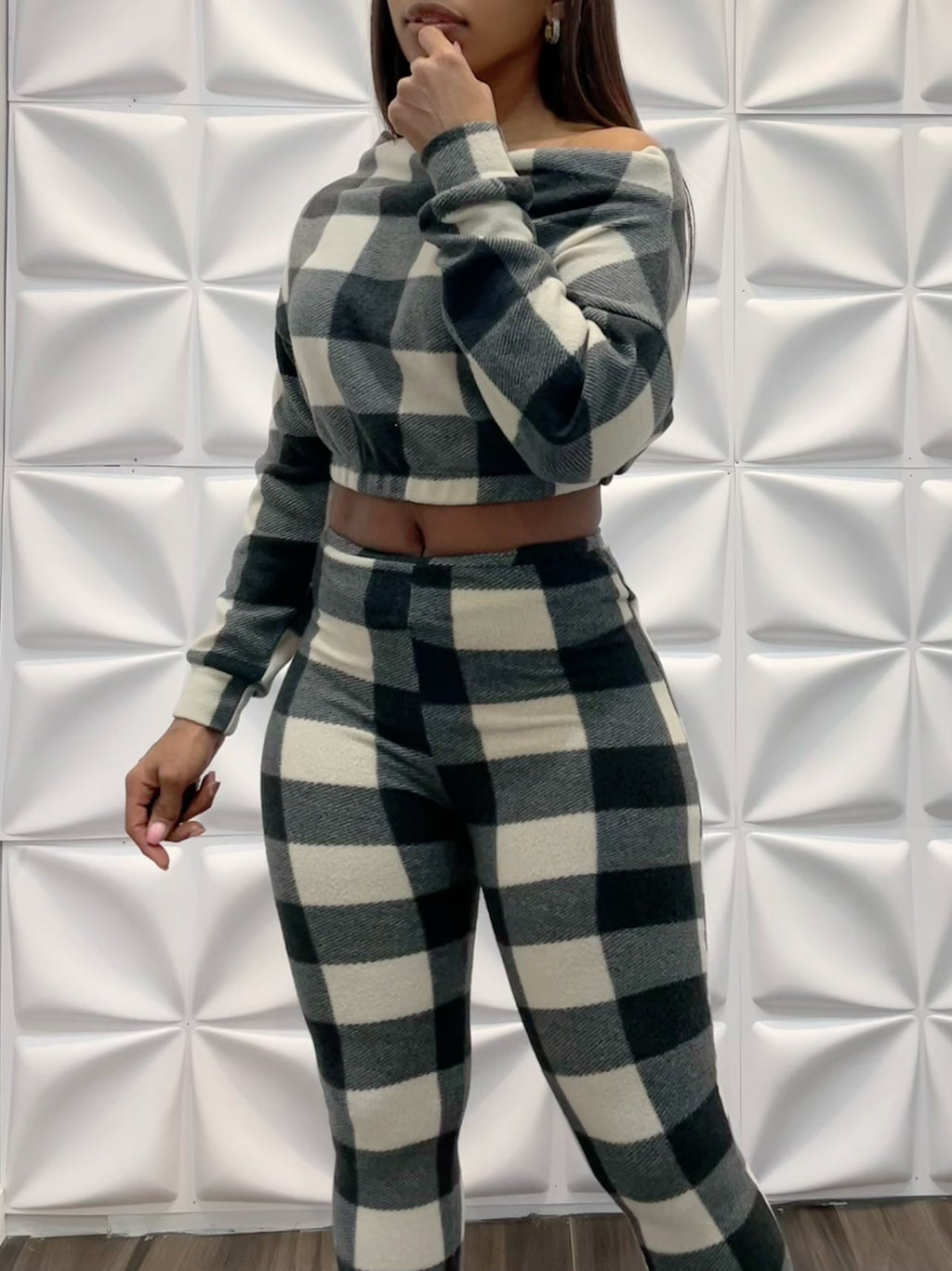 Checkered two-piece fleece outfit set by TrendzbyShe featuring a cozy top and matching pants in a classic checkered pattern.