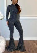 Black ribbed glitter flare jumpsuit by TrendzbyShe, featuring long sleeves, bodycon fit, and stylish flare legs.