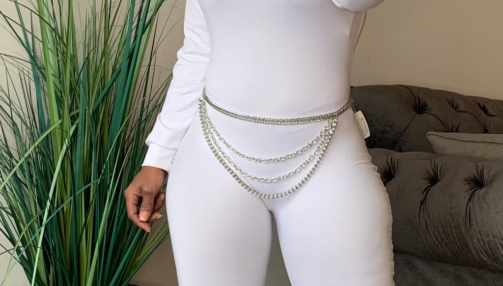 Silver rhinestone chain belt with drippy design from TrendzByShe, stylish accessories for fashion-forward outfits.